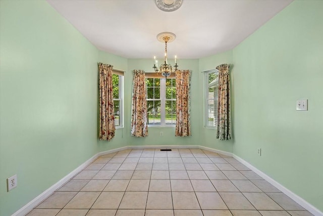 9 Edward Dr Unit 9, Grafton, MA 01536 - unfurnished dining area with a chandelier, baseboards, and tile patterned flooring