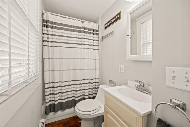 bathroom with vanity, toilet, baseboard heating, a shower with curtain, and hardwood / wood-style floors