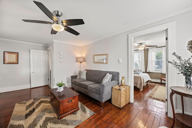 living room featuring ceiling fan, ornamental molding, and dark hardwood / wood-style flooring