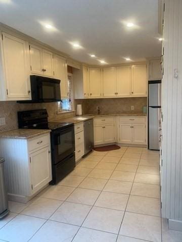 kitchen featuring light tile patterned floors, decorative backsplash, light countertops, black appliances, and recessed lighting