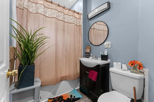 bathroom with vanity, a shower with curtain, and toilet