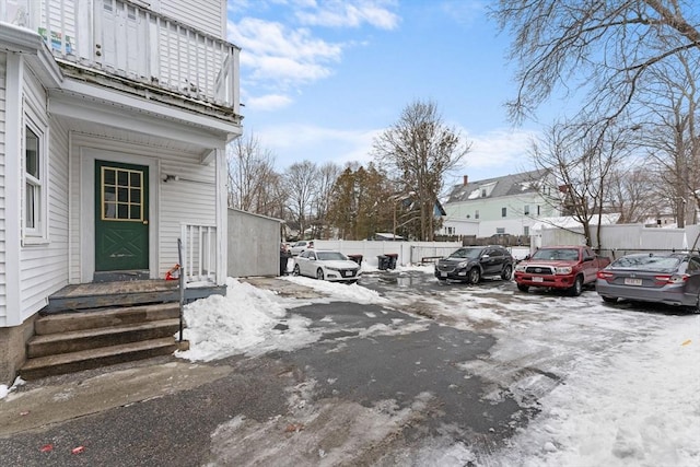 view of snow covered parking