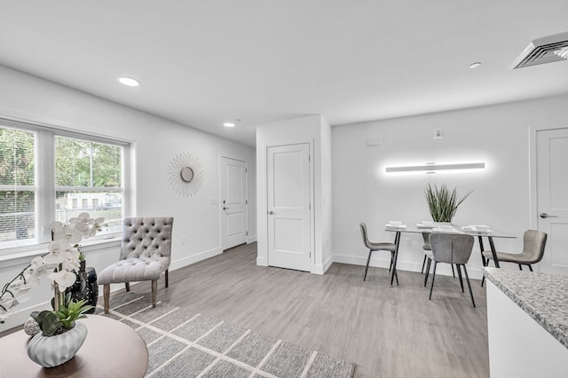 living area featuring light hardwood / wood-style floors