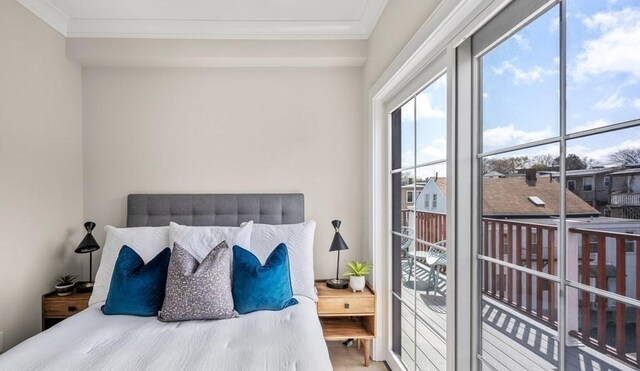 bedroom featuring wood-type flooring and ornamental molding