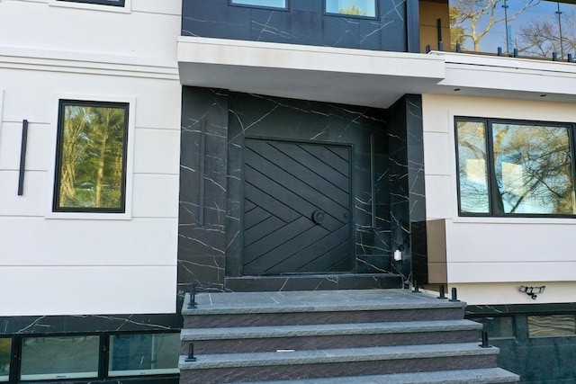 883 Greendale Ave, Needham, MA 02492 - doorway to property with stucco siding