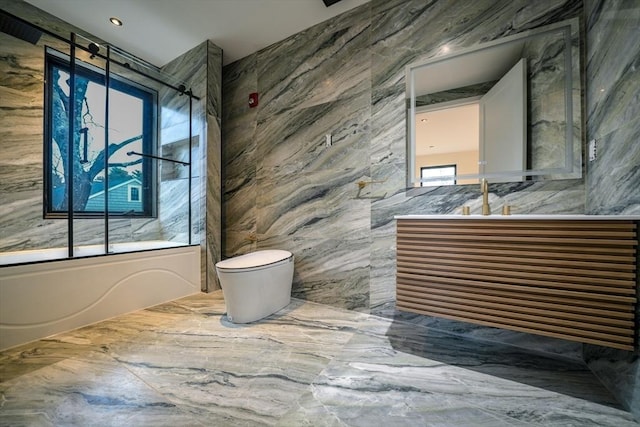 883 Greendale Ave, Needham, MA 02492 - full bath featuring tile walls, toilet, vanity, combined bath / shower with glass door, and marble finish floors