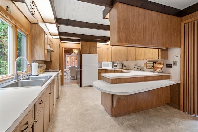 181 Thayer Farms Rd, Attleboro, MA 02703 - kitchen featuring white appliances, a sink, light countertops, wooden walls, and beam ceiling