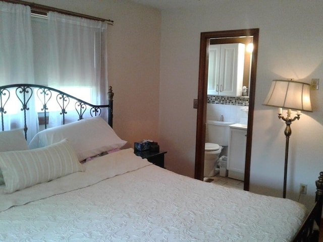 bedroom featuring ensuite bathroom