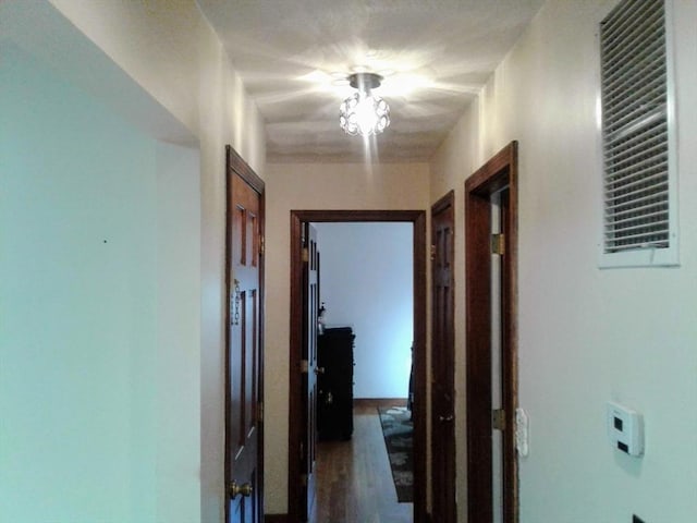 hallway with wood finished floors