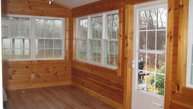 unfurnished sunroom featuring plenty of natural light