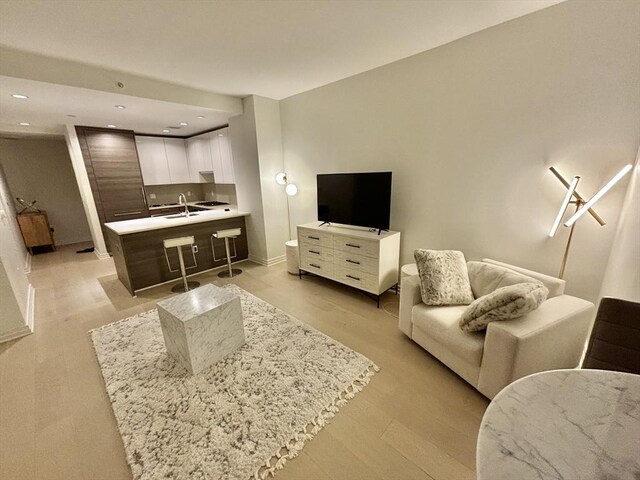 1 Franklin St Unit 1514, Boston, MA 02110 - living area with recessed lighting and baseboards