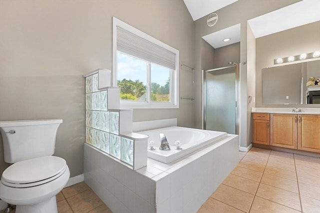full bath featuring vanity, toilet, tile patterned floors, a shower stall, and a garden tub