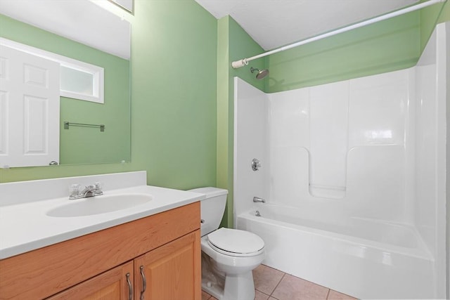 bathroom with vanity, tile patterned flooring, toilet, and tub / shower combination