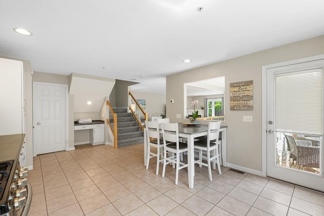 dining room featuring stairs, recessed lighting, baseboards, and light tile patterned floors