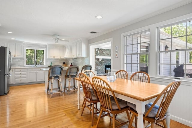 1051 Randolph Ave, Milton, MA 02186 - dining room with a ceiling fan, light wood-type flooring, crown molding, and recessed lighting