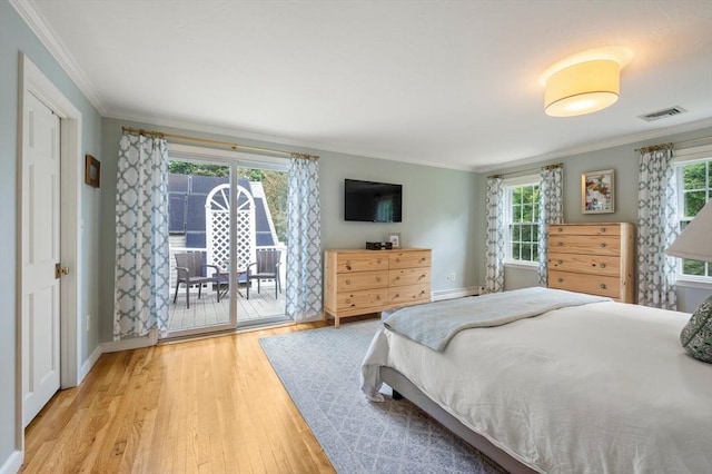 1051 Randolph Ave, Milton, MA 02186 - bedroom featuring access to outside, crown molding, wood finished floors, and baseboards