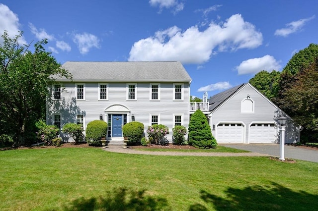 1051 Randolph Ave, Milton, MA 02186 - colonial house featuring driveway, a front yard, and a garage