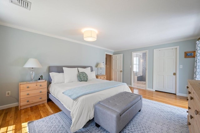 1051 Randolph Ave, Milton, MA 02186 - bedroom with wood finished floors, crown molding, baseboards, and ensuite bathroom