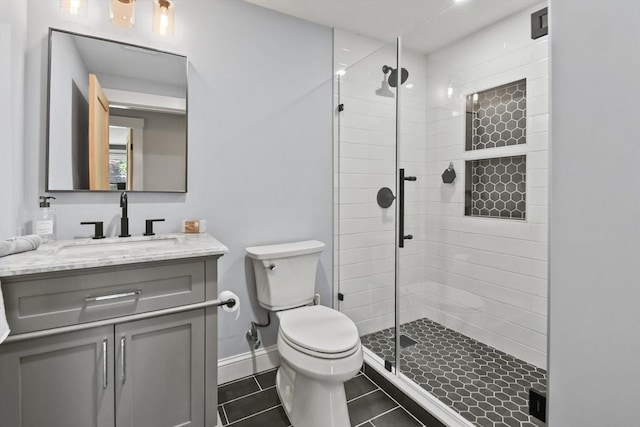 8 Longbow Cir, Lynnfield, MA 01940 - bathroom with toilet, a shower stall, vanity, tile patterned flooring, and baseboards