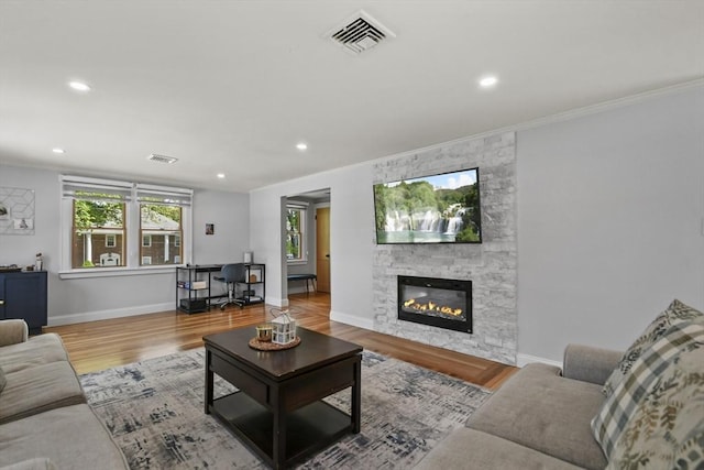 8 Longbow Cir, Lynnfield, MA 01940 - living room featuring recessed lighting, wood finished floors, healthy amount of natural light, baseboards, and a stone fireplace