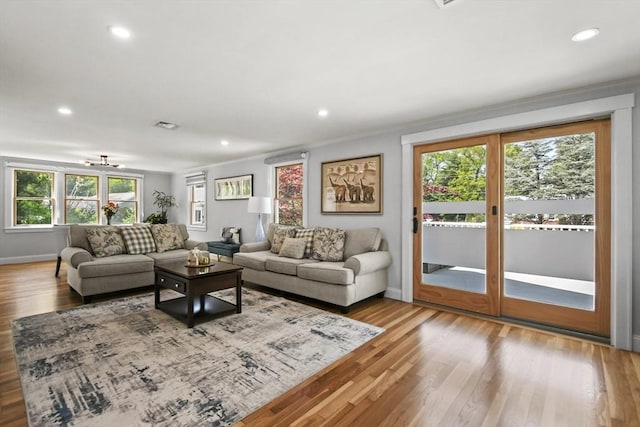 8 Longbow Cir, Lynnfield, MA 01940 - living room featuring plenty of natural light, baseboards, wood finished floors, recessed lighting, and crown molding