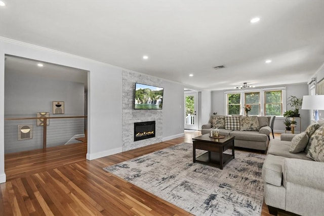 8 Longbow Cir, Lynnfield, MA 01940 - living area with baseboards, crown molding, a fireplace, recessed lighting, and wood finished floors