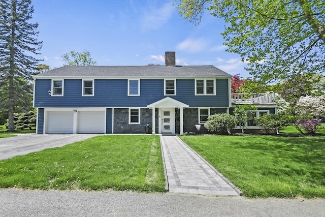 8 Longbow Cir, Lynnfield, MA 01940 - view of front of property with a chimney, a garage, asphalt driveway, and a front yard