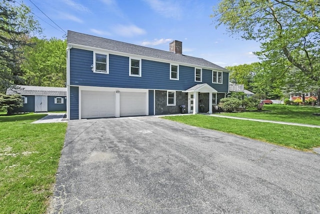 8 Longbow Cir, Lynnfield, MA 01940 - colonial home featuring a chimney, a garage, a front yard, and asphalt driveway