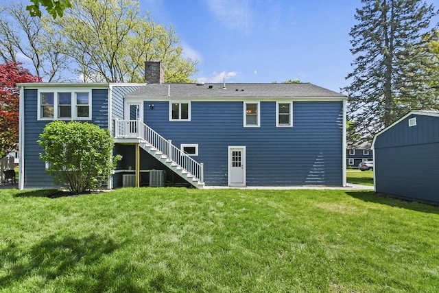8 Longbow Cir, Lynnfield, MA 01940 - rear view of property with a chimney, a yard, central air condition unit, and stairs