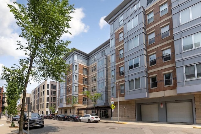 16 Miner St Unit 506, Boston, MA 02215 - view of apartment building / complex featuring an attached garage