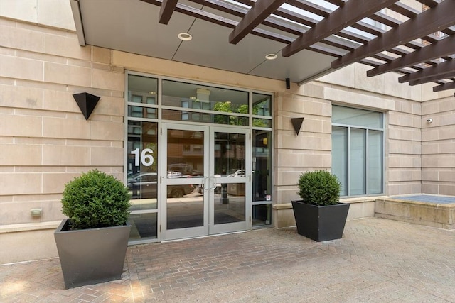 16 Miner St Unit 506, Boston, MA 02215 - property entrance featuring french doors, a pergola, and a patio