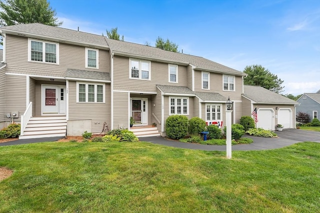 142 Laurelwood Dr Unit 142, Hopedale, MA 01747 - view of front of home featuring a front lawn and a detached garage