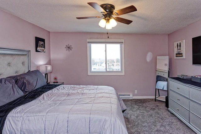 carpeted bedroom featuring a baseboard heating unit, ceiling fan, a textured ceiling, and baseboards