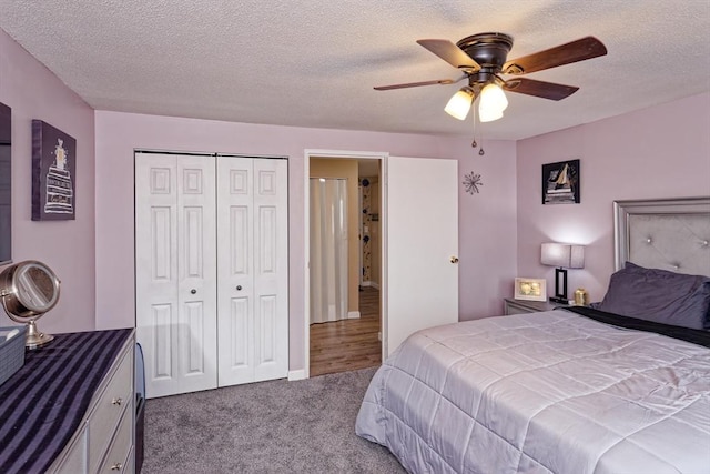 bedroom featuring carpet, a closet, ceiling fan, and a textured ceiling