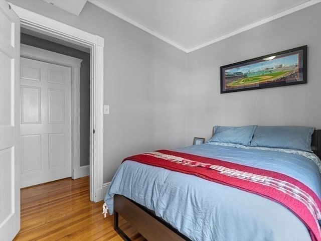 29 Chelmsford St Unit 2, Boston, MA 02122 - bedroom featuring light wood-type flooring and ornamental molding