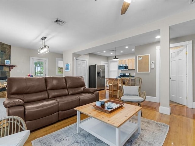 29 Chelmsford St Unit 2, Boston, MA 02122 - living area with light wood-style flooring, ceiling fan, recessed lighting, and a multi sided fireplace