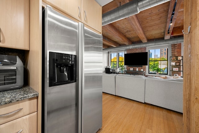 kitchen featuring light brown cabinetry, light hardwood / wood-style floors, beamed ceiling, wooden ceiling, and stainless steel refrigerator with ice dispenser