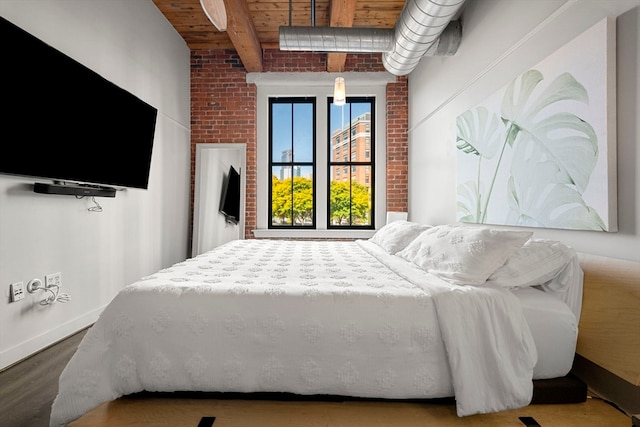 bedroom featuring wood ceiling, hardwood / wood-style floors, and beamed ceiling