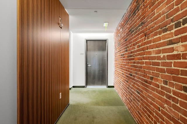 corridor with brick wall and carpet floors