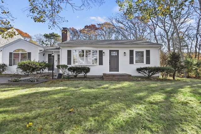 single story home with a front yard