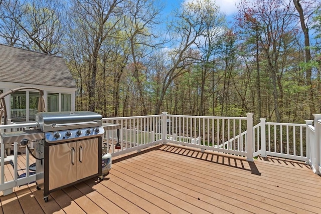 wooden terrace featuring grilling area