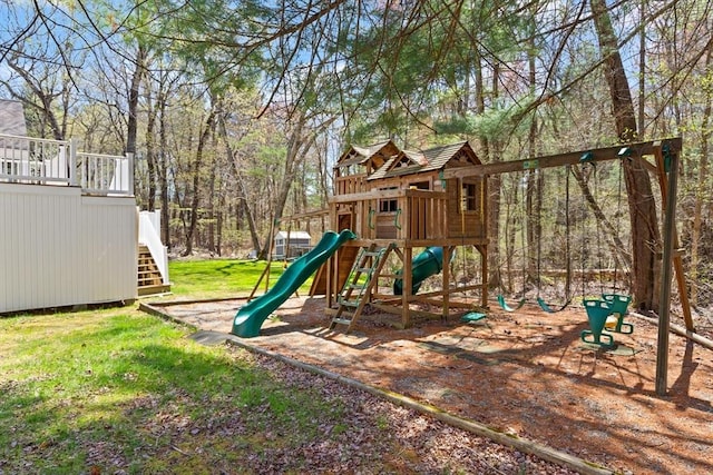 community playground featuring a yard and stairs
