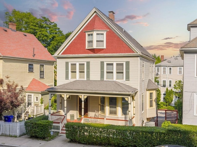 10 John A Andrew St, Boston, MA 02130 - view of front of property featuring covered porch, a chimney, and central air condition unit