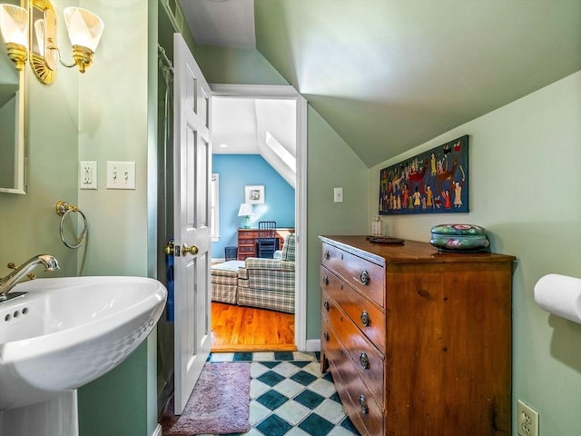10 John A Andrew St, Boston, MA 02130 - ensuite bathroom featuring vaulted ceiling, a sink, and tile patterned floors