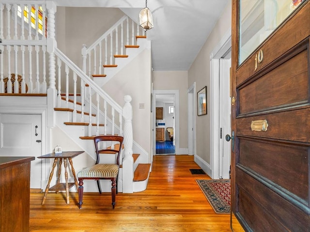 10 John A Andrew St, Boston, MA 02130 - foyer with wood finished floors, stairs, and baseboards