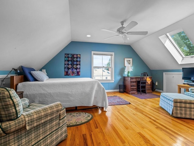 10 John A Andrew St, Boston, MA 02130 - bedroom featuring a skylight, vaulted ceiling, wood finished floors, a ceiling fan, and baseboards