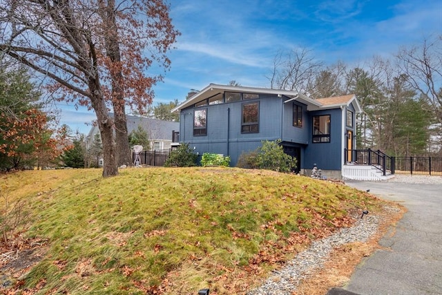 view of side of property featuring a lawn