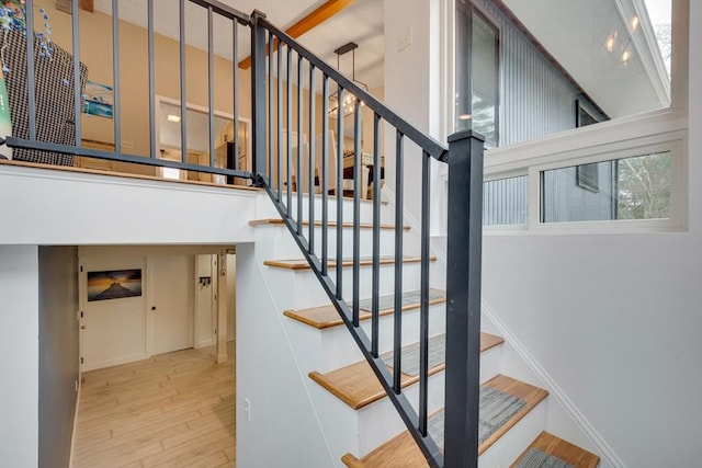 staircase featuring hardwood / wood-style flooring