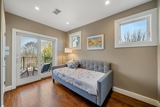 bedroom with access to exterior, visible vents, baseboards, recessed lighting, and wood finished floors