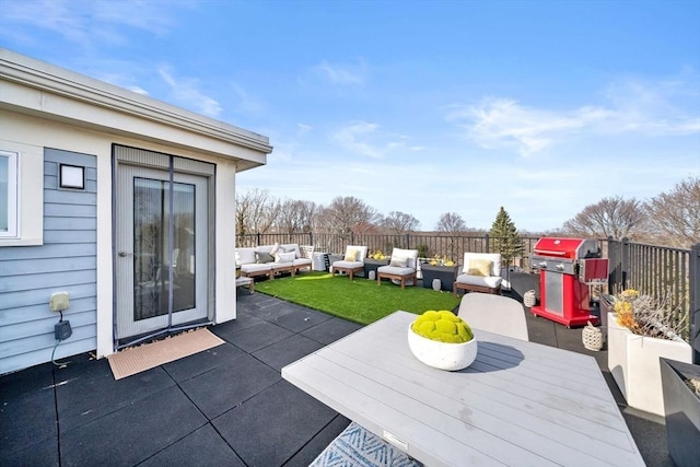 view of patio with outdoor dining space, grilling area, fence, and an outdoor hangout area